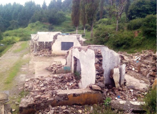 A view of what remains of the government high school building in Amnavi, Shangla. &mdash; Dawn