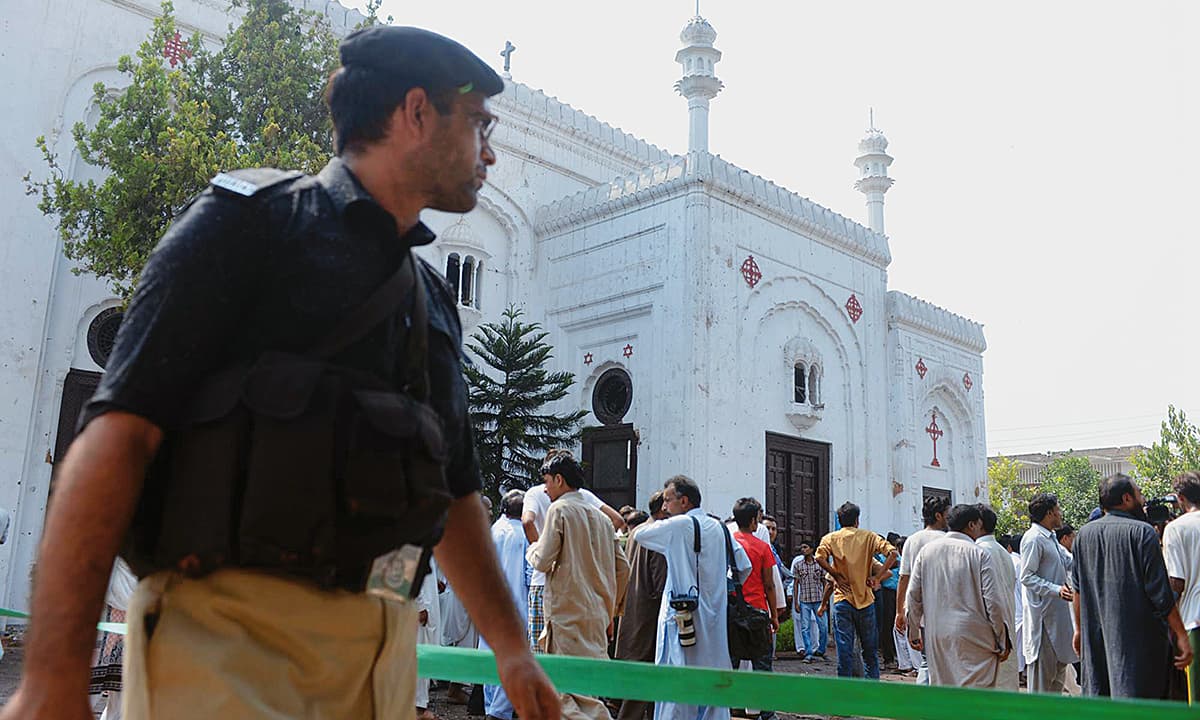 Security personnel and rescue workers gather at  the All Saints Church in Peshawar after a suicide blast | Abdul Majeed Goraya, White Star