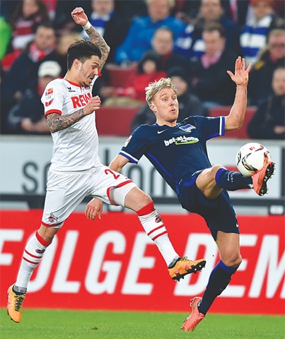 COLOGNE: Berlin&rsquo;s Per Ciljan Skjelbred (R) and Cologne&rsquo;s Leonardo Bittencourt vie for the ball during their Bundesliga match.&mdash;AP