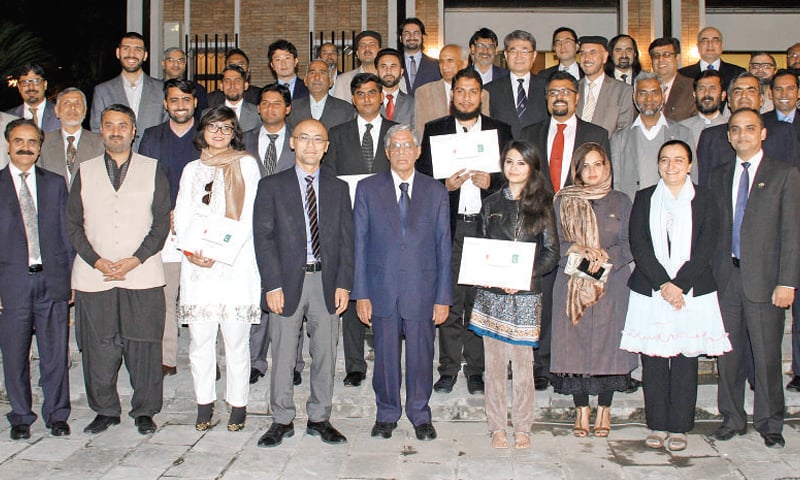 Japanese charge d&rsquo;affaires ad interim Junya Matsuura poses with students awarded MEXT Research Scholarship.