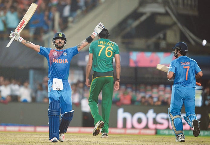 KOLKATA: Virat Kohli (left) celebrates with captain Mahendra Singh Dhoni after India&rsquo;s victory.&mdash;AFP