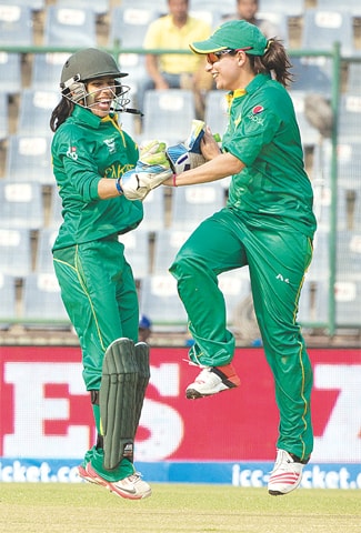 NEW DELHI: Sana Mir (right), the captain of Pakistan women cricket team, celebrates the fall of an Indian wicket with wicketkeeper Sidra Nawaz during their ICC Women&rsquo;s Twenty20 World Cup match at the Feroz Shah Kotla Stadium on Saturday. Pakistan, chasing a target of 97, beat India by two runs on the Duckworth-Lewis-Stern method after rain disrupted the clash at the end of 16 overs. Pakistan were 77 for 6 at that stage.&mdash;AP Report on Page 24