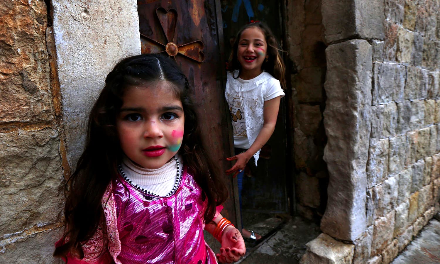 Iraqi Kurdish children pose for a photo. ─ AFP