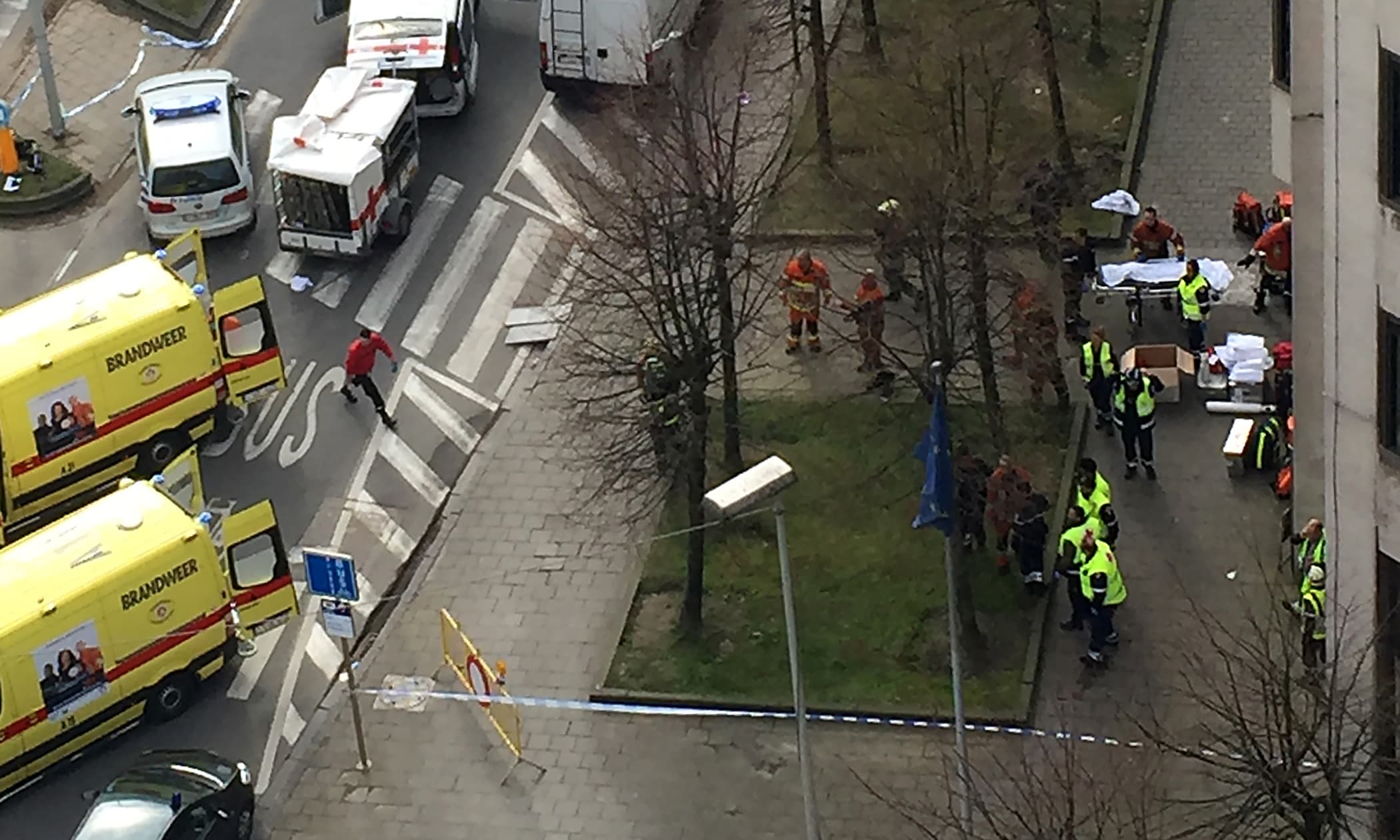 Rescue teams evacuate wounded people outside the Maalbeek metro station in Brussels on March 21, 2016 after a blast at this station located near EU institutions. ─ AFP