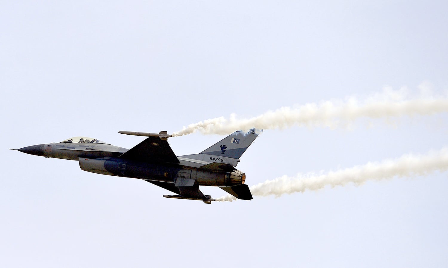 An F-16 fighter performs a flypast during parade. ─ AFP