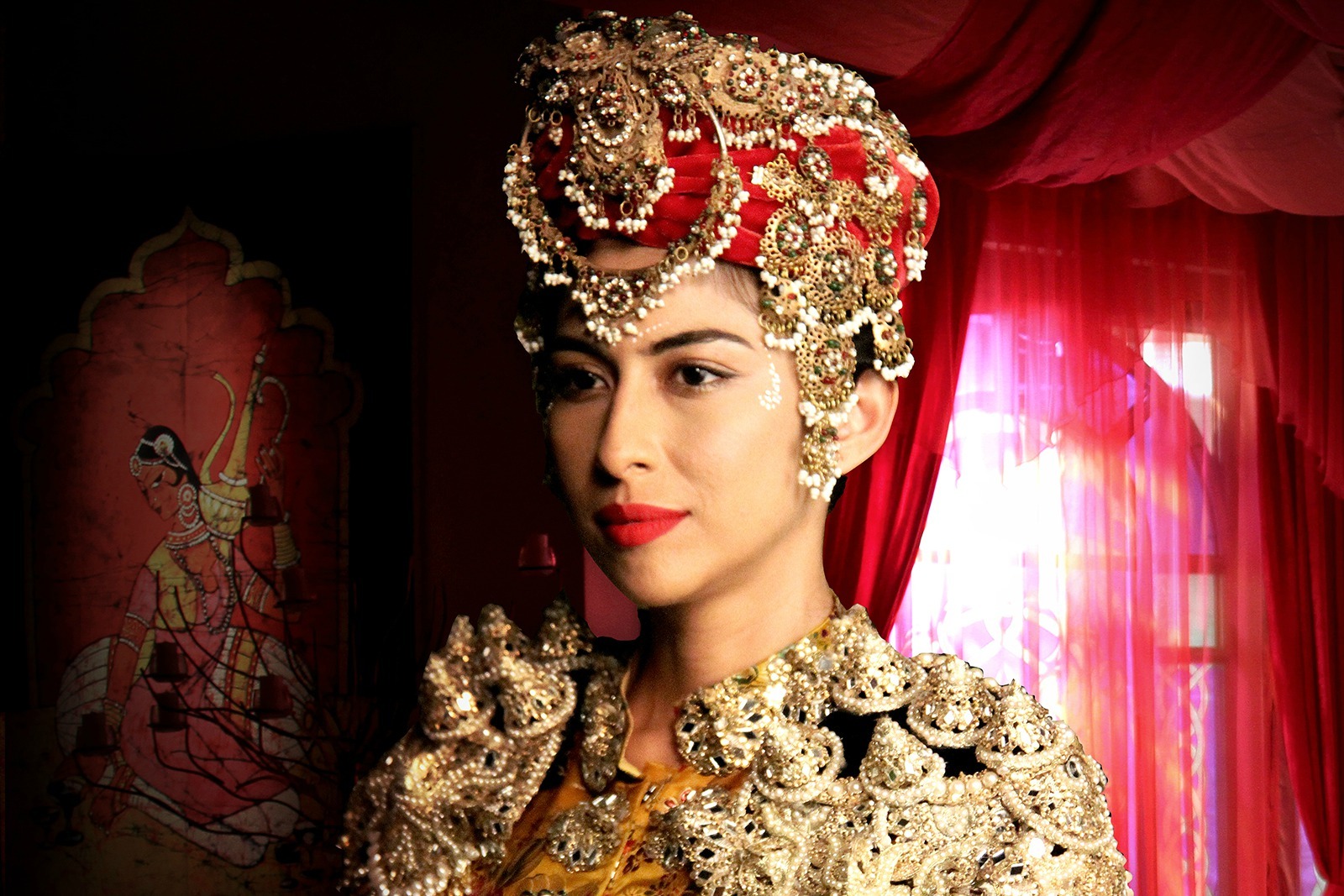 Meesha Shafi's headgear was encrusted with jewellery for a festive in Mor Mahal