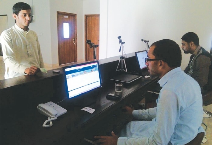 AN applicant approaches an official of the Sindh Board of Revenue&rsquo;s People&rsquo;s Service Centre in Hyderabad, one of 26 such centres set up across the province for computerisation of land records.