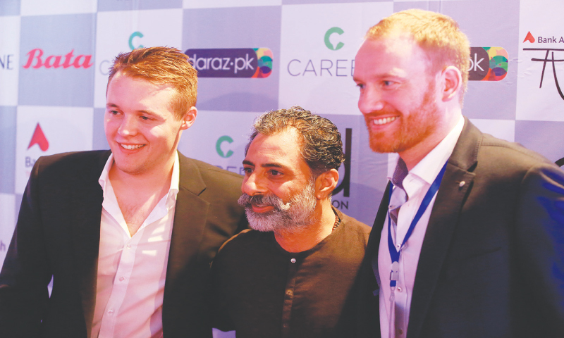 Marco Feelisch and Jonathan Doerr with Yousuf Bashir Qureshi (C)
