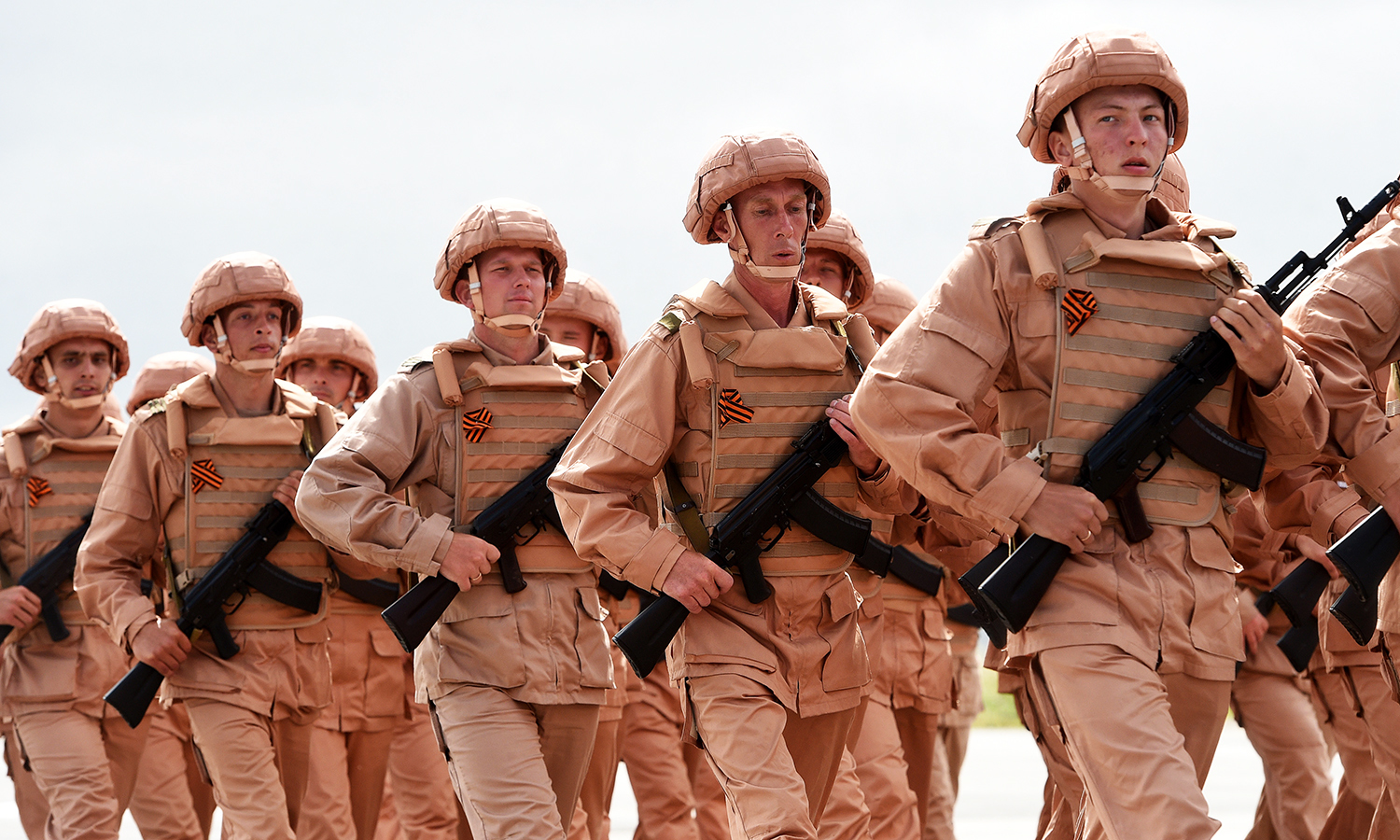 Russian soldiers march during a rehearsal of the Victory Day Parade at the Russian Hmeimim military base in Latakia province. -AFP