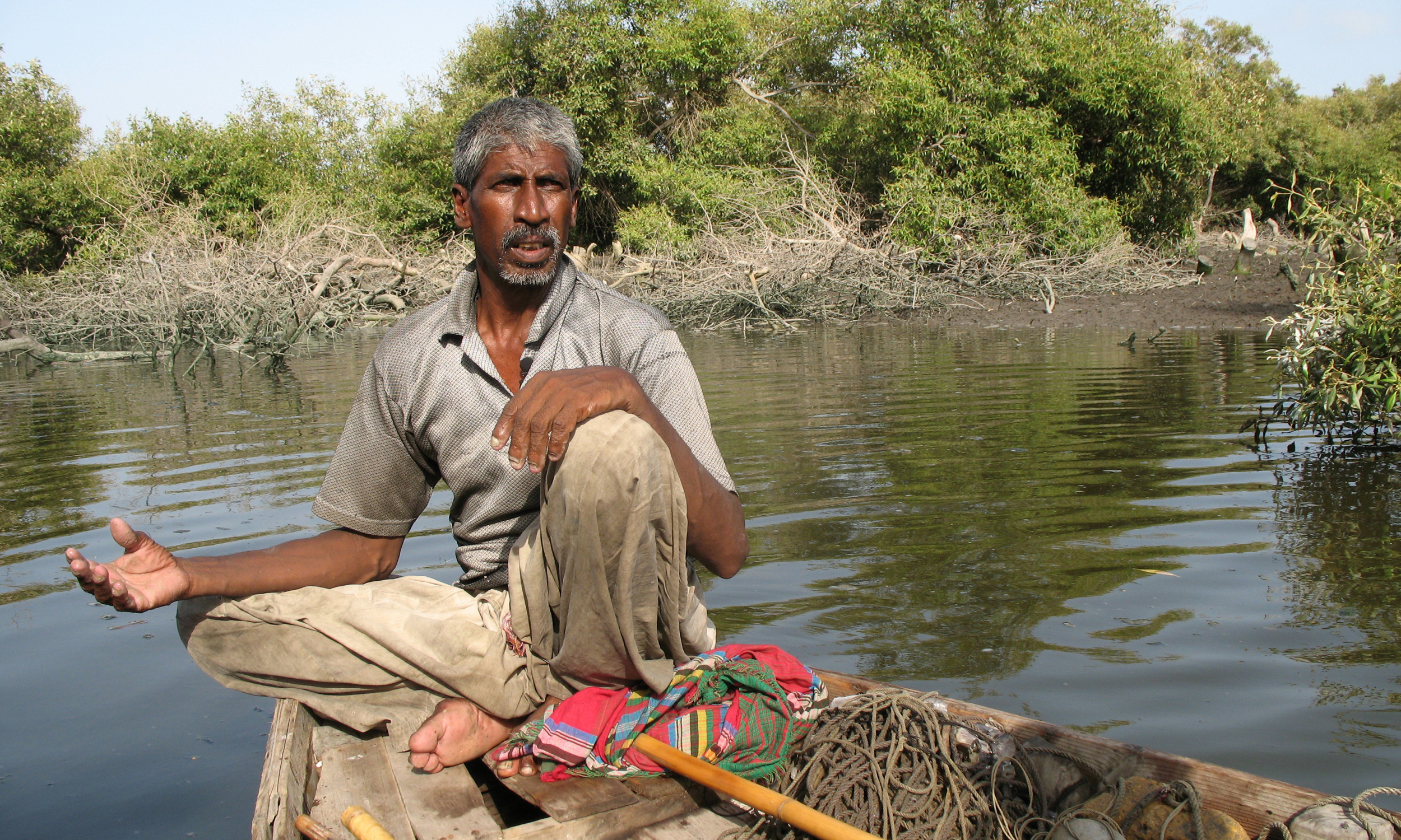 A fisherman in the backwaters of Sandspit Beach in Karachi