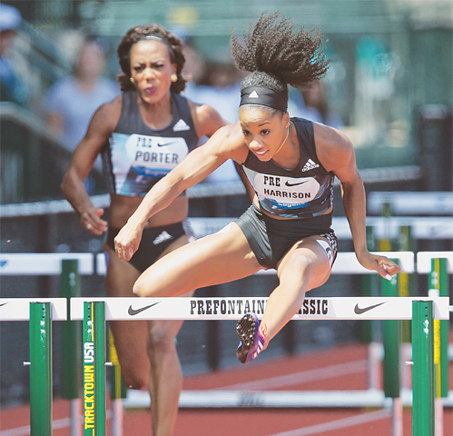 EUGENE: Kendra Harrison (R) clears the last hurdle ahead of Tiffany Porter on her way to a win in the women&rsquo;s 100m hurdles at the Prefontaine Classic athletics meet.&mdash;AP