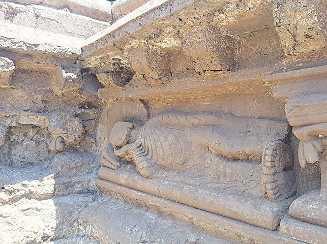 THE smaller version of the Sleeping Buddha set on a plinth of a stupa in Bhamala.—Photo by writer