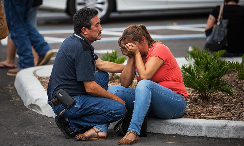 Friends and family grieve after a list of hospitalised victims was released, implying the death of those who weren't on the list and hadn't been heard from in Orlando, Fla., Sunday, June 12, 2016. —AP