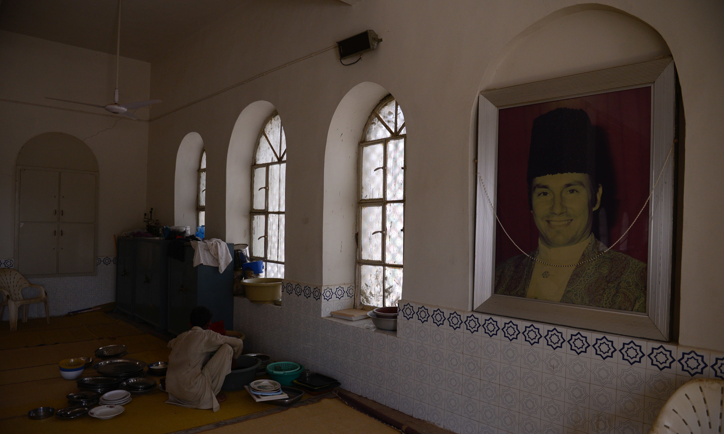 A man prepares for the gathering at the Ismaili jamaat khana in Jhimpir | Tahir Jamal, White Star