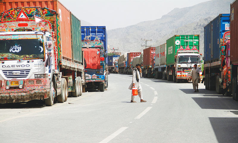 Transit trucks stranded due to the border skirmishes between Pakistan and Afghanistan are parked on the side of the road leading to the Torkham border.—Reuters