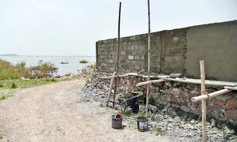 A wall of a house being built.— Dawn