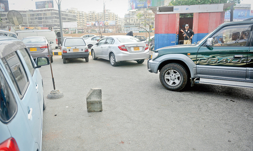 Police have placed a large stone at the car park of the supermarket in Clifton where Advocate Awais Ali Shah parked his car before being taken away by masked men on Monday.—Photo by Fahim Siddiqi/ White Star