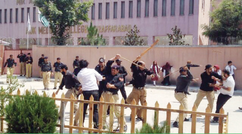 Police baton-charge students on the premises of the medical college on Wednesday. &mdash; Dawn