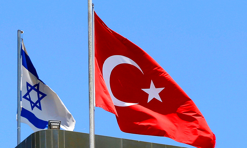 A Turkish flag flutters atop the Turkish embassy as an Israeli flag is seen nearby, in Tel Aviv, Israel on June 26, 2016.  ─ Reuters