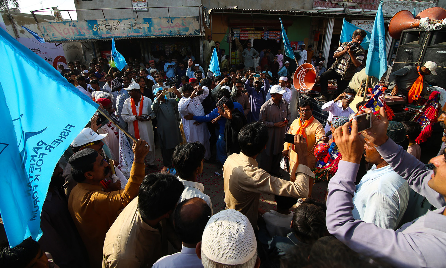 At the centre of the bazaar at Chotiari, District Sanghar local activists and members of the PFF dance to tunes.