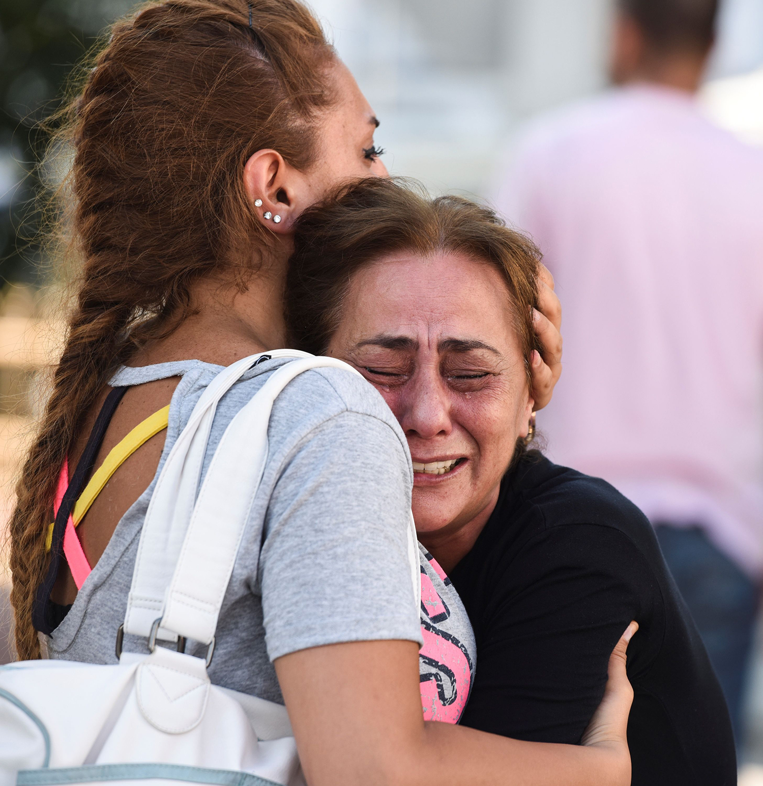 A mother of victims reacts outside a forensic medicine building close to Istanbul's airport. — AFP