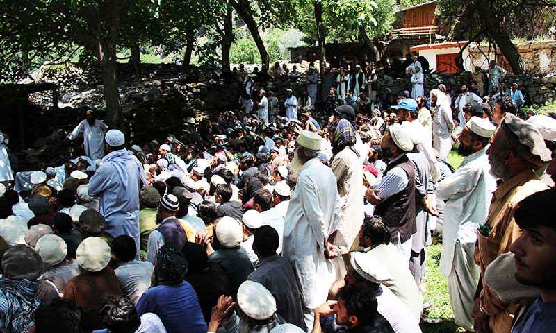 Pakistani villagers gather after the flash flood in Ursoon village in Chitral on July 3, 2016. ─ AFP