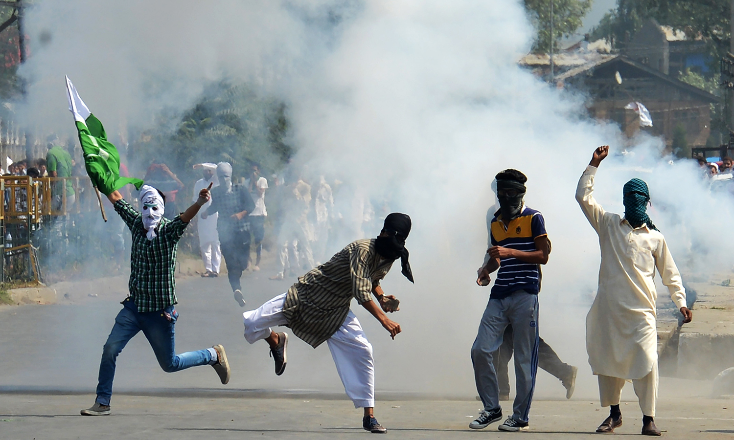 Kashmiri protesters clash with Indian police as they took to the streets chanting pro-freedom slogans after Eid prayers in Srinagar. —AFP