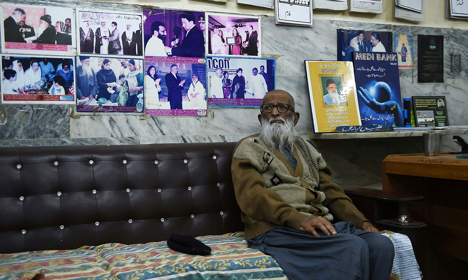 Abdul Sattar sits in his office. —AFP