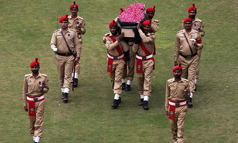 Pakistani soldiers carry the coffin containing the body of Abdul Sattar Edhi.— AP