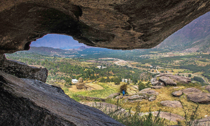 A view of the Balokaley vihara from a cave at Kandak valley in Barikot, Swat. — Dawn photo