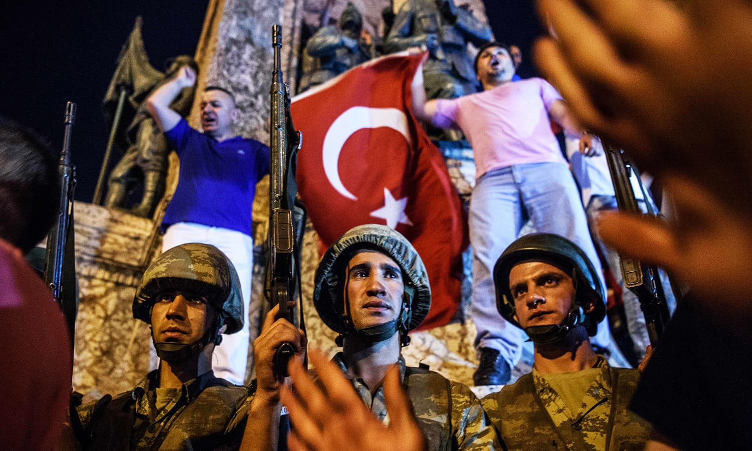 Turkish soldiers stay at Taksim square as people react in Istanbul on July 16. — AFP