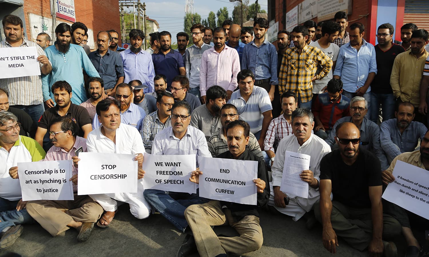 Kashmiri journalists hold placards as they protest against the government in Srinagar, India- held Kashmir.─AP