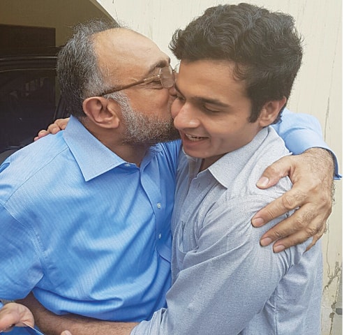 SINDH High Court Chief Justice Sajjad Ali Shah greets his son, Barrister Awais Ali Shah, on his return in Karachi.&mdash;APP