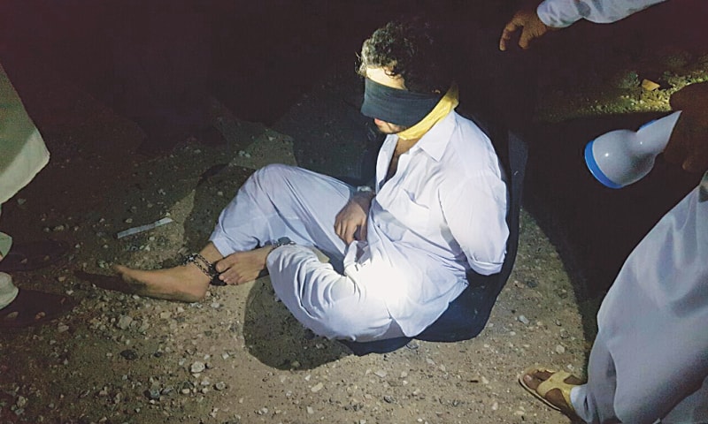 TANK: In these handout photographs released by the Inter-Services Public Relations (ISPR), Barrister Awais Ali Shah (right) is shown blindfolded and shackled before being on his way to freedom in a pickup truck.&mdash;APP