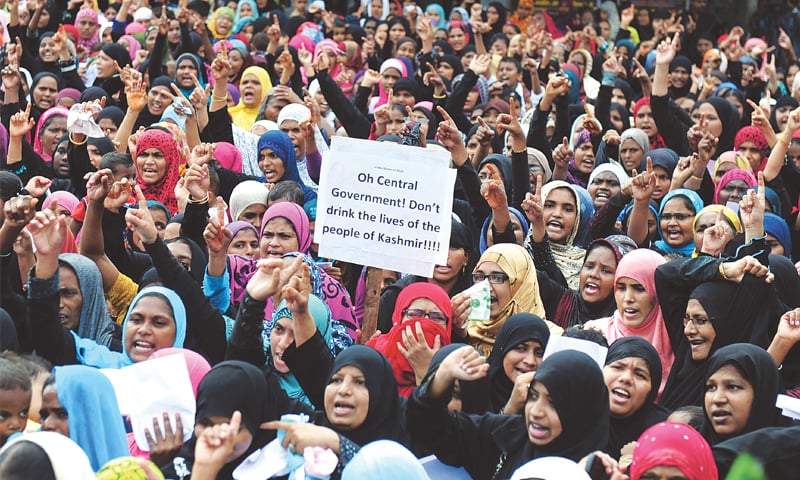 CHENNAI: Members of the Tamil Nadu Towheed Jamaat group hold placards and shout slogans here on Wednesday against the Indian government’s actions in India-held Jammu and Kashmir.—AFP