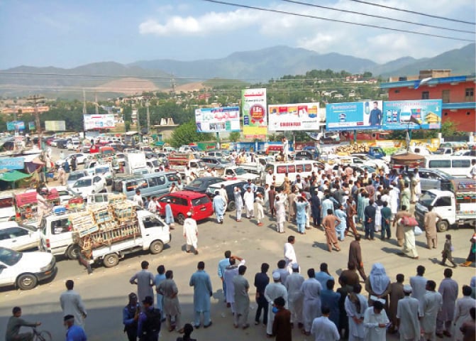Traffic mess during an anti-Customs Act rally in Timergara on Thursday. &mdash; Dawn