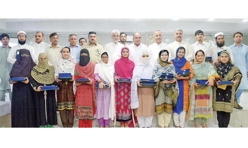 Position-holders and officials of BISE Peshawar pose for a group photo. — White Star Position-holders and officials of BISE Peshawar pose for a group photo. — White Star