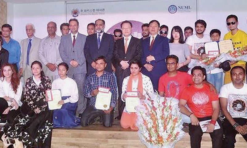 South Korean Ambassador Suh Dong-gu, Numl Rector Brig Aminullah Khan and participants at the K-Pop Music and Cultural Dance Festival in Islamabad.
