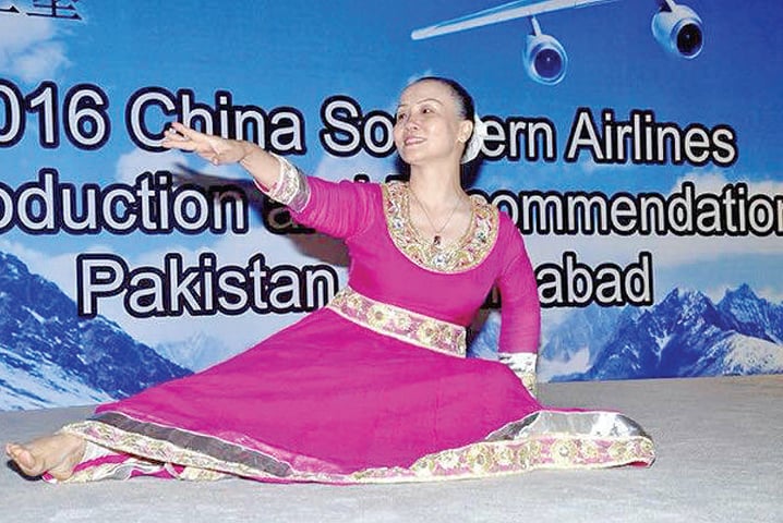 A dancer entertains guests at the China Southern Airlines event in Islamabad.