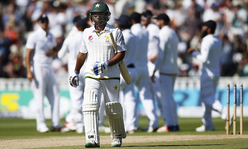 Sami Aslam walks off after being bowled by England's Steven Finn. — Reuters