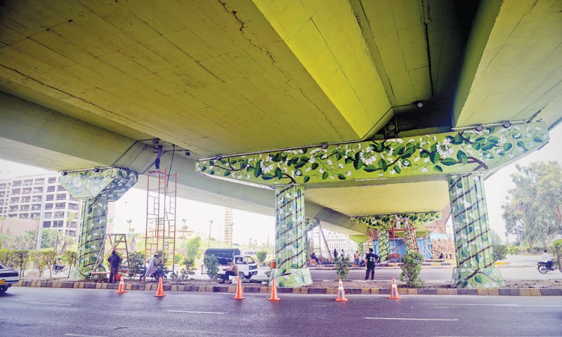 Pretty flowery climbers being painted on the pillars and underside of the FTC flyover.