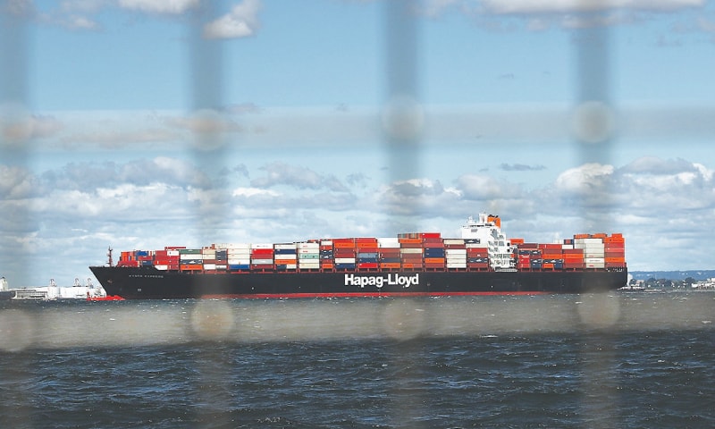 A fully loaded cargo ship heads out to sea from New York Harbour in this file photo. &mdash; AFP/File
