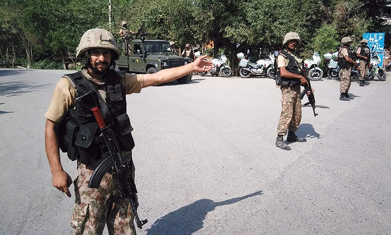 Soldiers cordon off a street leading to Christian colony.— AFP