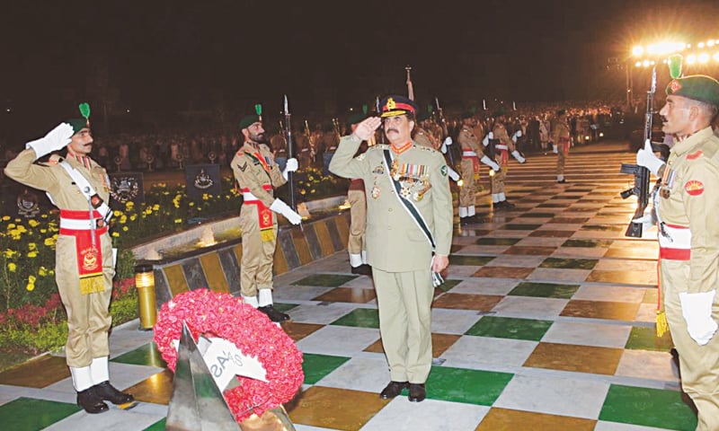 Army Chief Gen Raheel Sharif salutes after laying a wreath at the Yadgar-i-Shuhada at a Defence Day ceremony at the GHQ on Tuesday.&mdash; APP