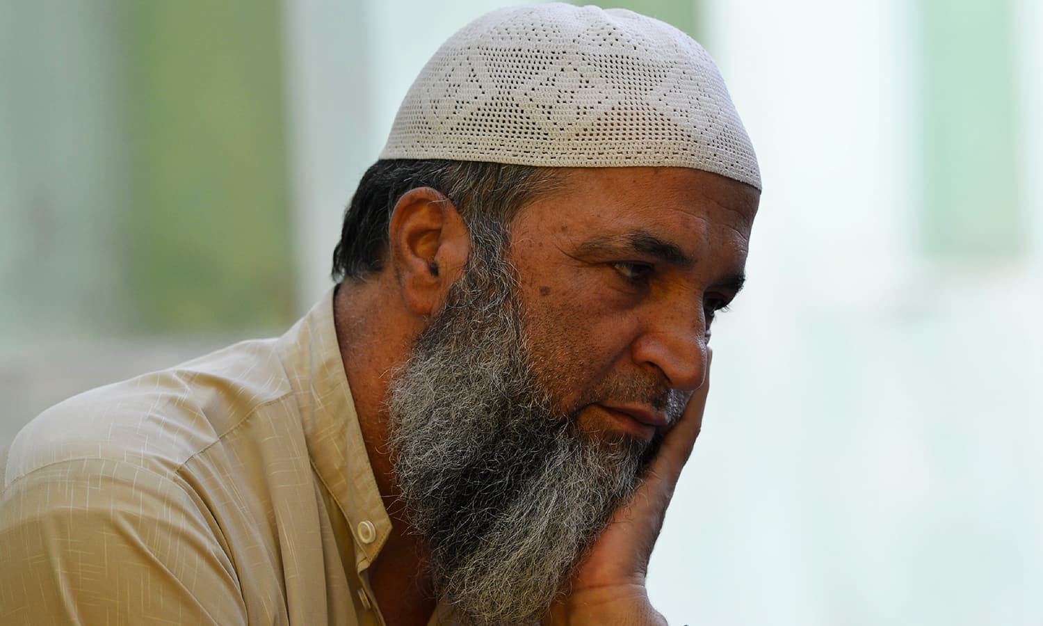 In this picture taken on September 12, 2016, father of slain Hizbul Mujahideen commander Burhan Wani, Muzaffar Wani, sits in his home in Tral, a day before Eid. ─ AFP