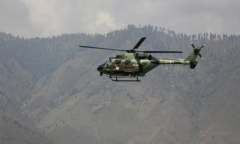 An Indian army helicopter flies above the army base which was attacked. &mdash; AP
