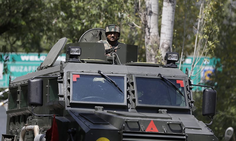 An Indian army soldier guards the army base which was attacked by suspected rebels in the town of Uri, India-held Kashmir. &mdash; AP