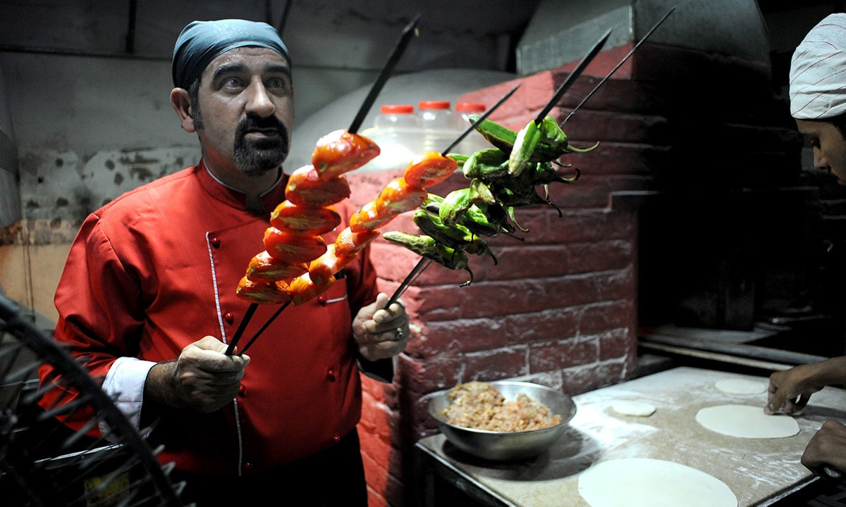 Chef Haydar Acik grills vegetables for Turkish kebabs at Lale-i-Rumi