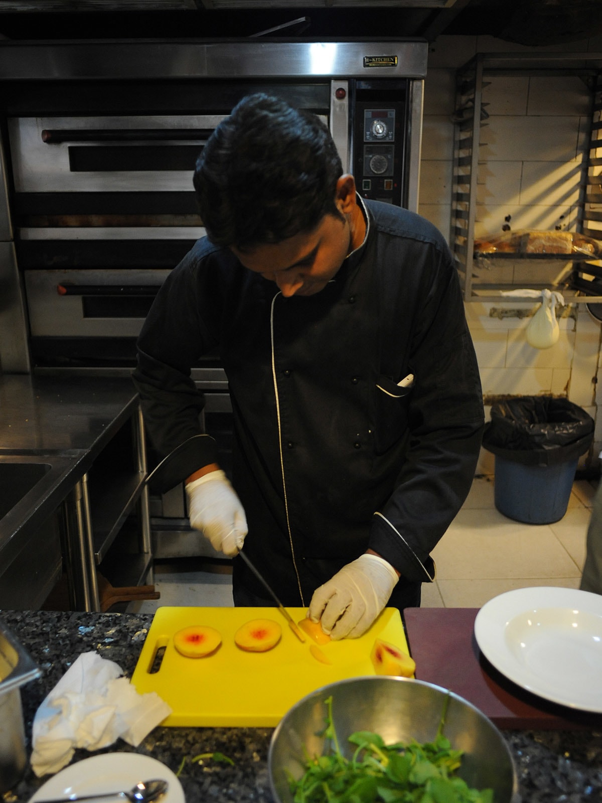 Chef Abdul Samad prepares a salad of fresh seasonal fruits and veggies