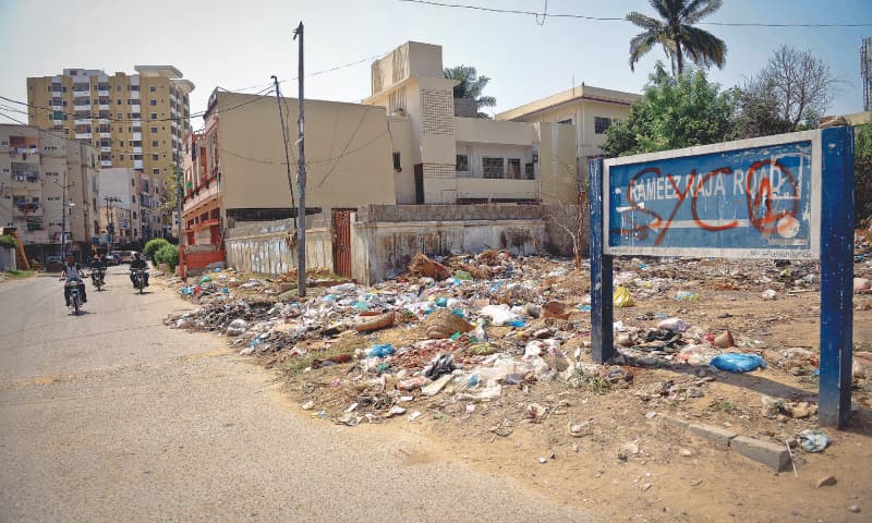 A garbage dump at the entrance of a road named after Ramiz Raja. / Photos by Fahim Siddiqi/White Star